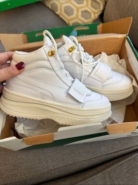 Puma White High-Top Platform Sneakers with Gold Eyelets